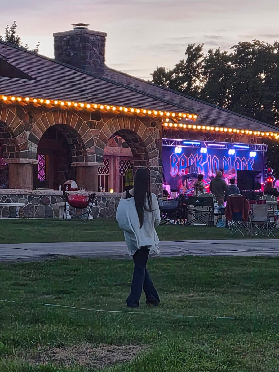 Back in Black on stage at dusk at Fred Fest I