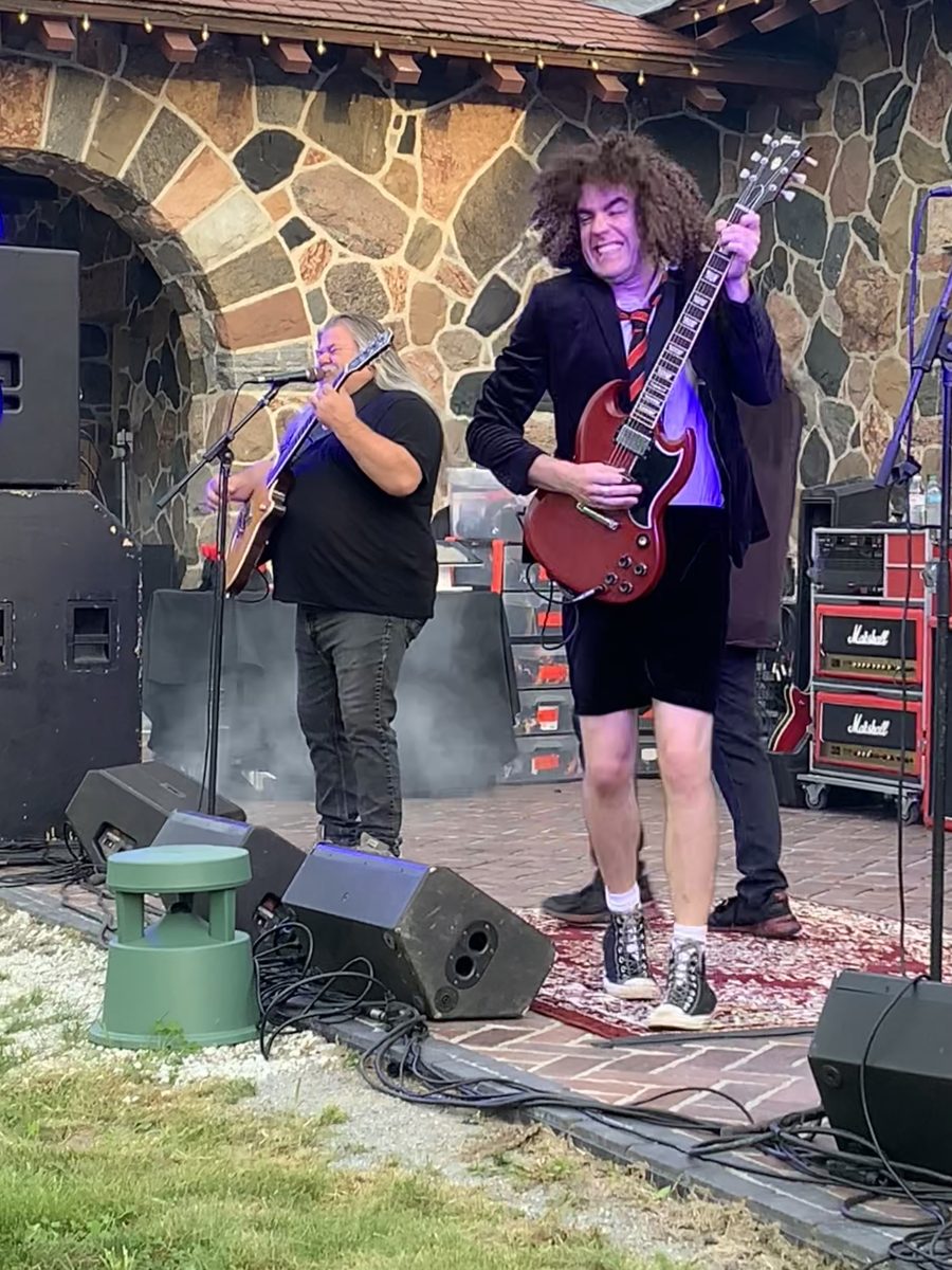 Back in Black guitarists rocking the stage