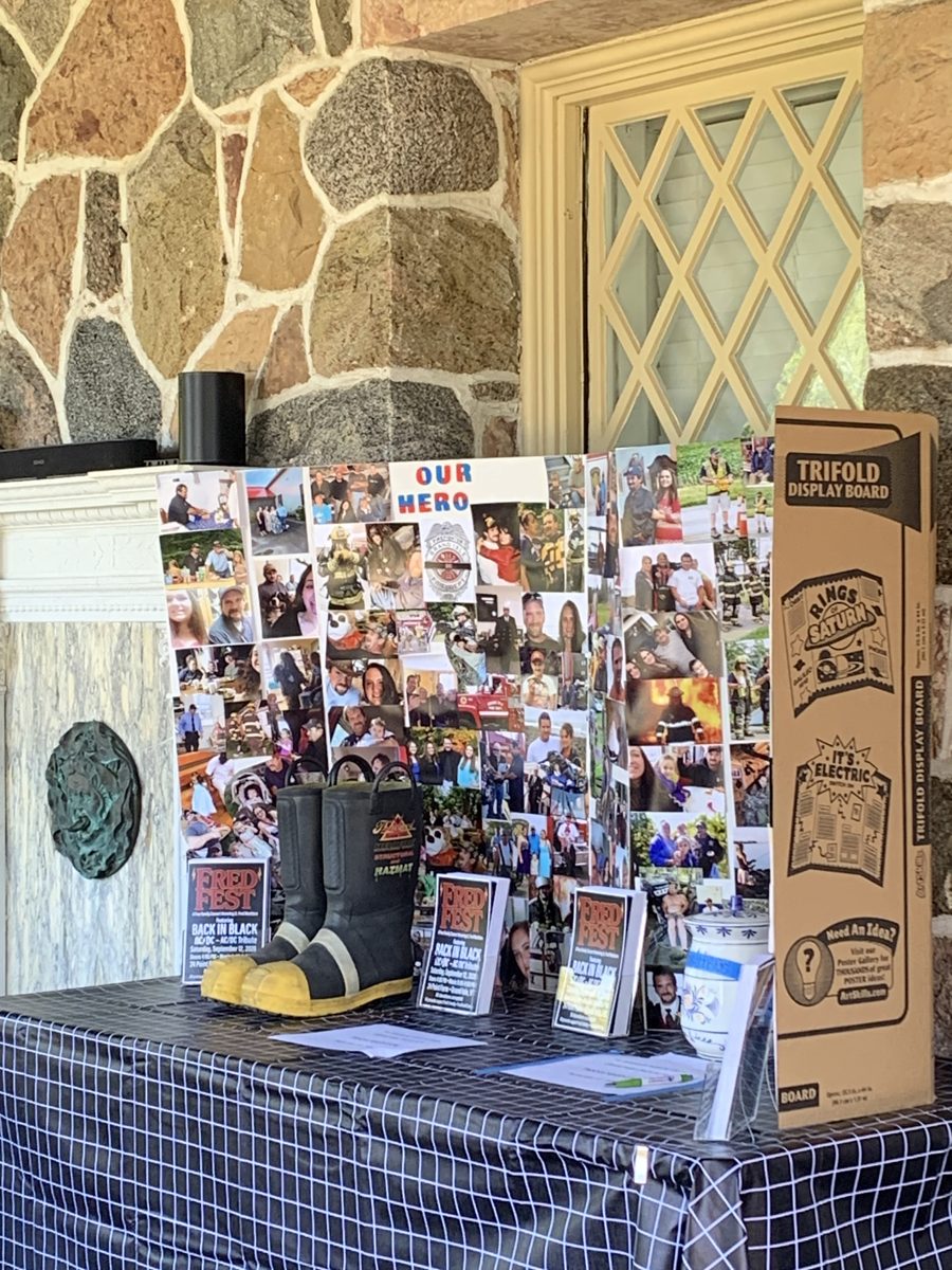 Our Hero memorial board with Fred's fire boots